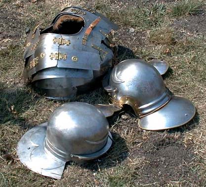 Armour used by Legio X members.  The cuirass is a Corbridge Type B segmented Lorica with hooks holding the upper portion to the torso.  The helmets are both of similar construction and are of the Coolus type.